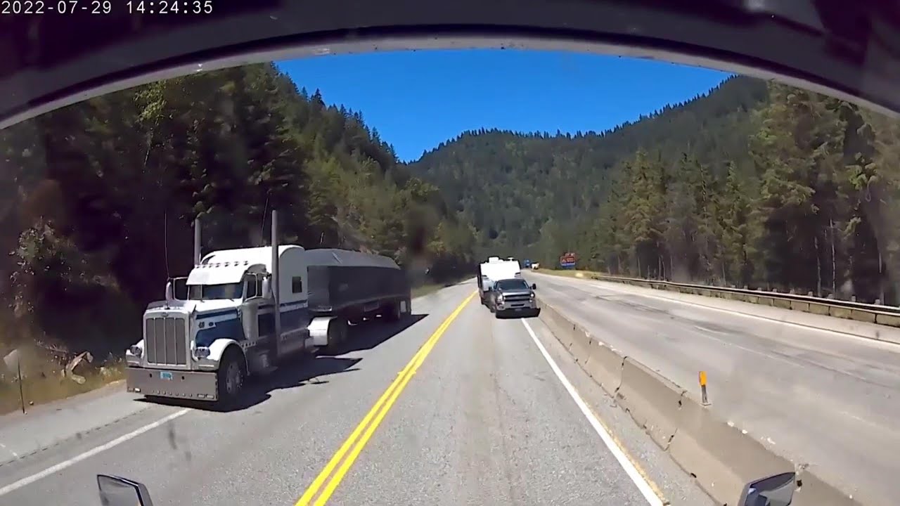 Careful when you pass another vehicle | Driver trapped by seatbelt in overturned truck